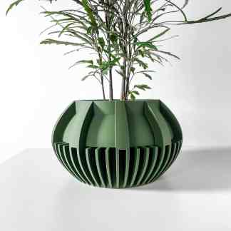 A modern, 3D-printed green planter featuring detailed geometric design perfect for stylish indoor garden decor.