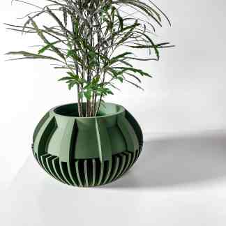 3D-printed green geometric plant pot with intricate design.