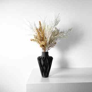3D printed black vase with dried white and gold flowers, perfect for modern home decor.