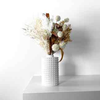 Vase with intricate 3D textured design holding dried flowers, perfect for stylish home decor.