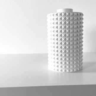 White textured vase with intricate geometric patterns, perfect for modern home decor and design inspiration.