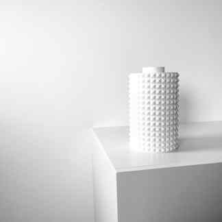Modern 3D printed decorative object with geometric patterns.