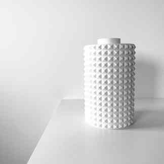 3D printed white geometric vase with textured pyramid design for modern decor.