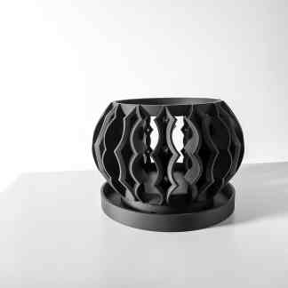 Alt text: Modern black 3D printed decorative planter with intricate design on a white surface.