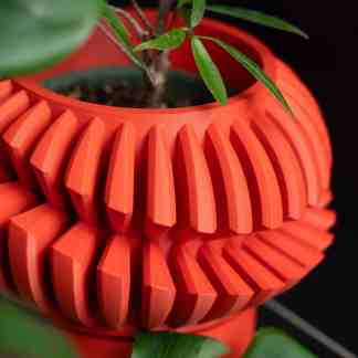 High-quality 3D-printed plant pot with unique textured pattern for modern decor.