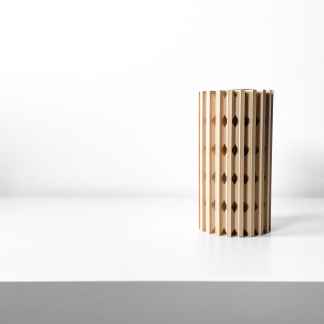 Minimalist wooden sculpture with geometric patterns for stylish home decor.