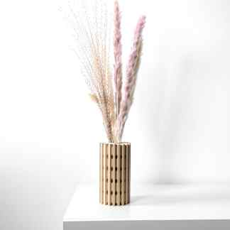 Minimalist 3D-printed wooden vase with natural dried grass for elegant home decor.