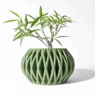 3D printed geometric green vase with intricate patterns for home decor or art projects.