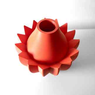 Vibrant red 3D-printed geometric object with a conical shape and star-like base, showcasing advanced 3D printing technology.