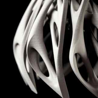 Close-up of a sleek, abstract metallic art piece showcasing advanced craftsmanship and contemporary design.