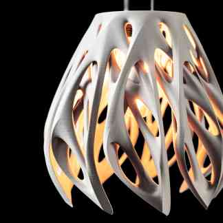 A contemporary LED lamp featuring intricate, artistic cut-outs, perfect for modern interior decor.