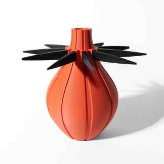 High-quality 3D printed vase with striking black spiky details and a sleek orange finish.