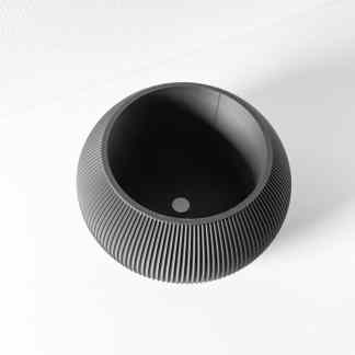 Stunning black 3D printed vase with detailed textured surface, perfect for contemporary home decor.