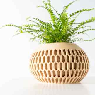 3D-printed beige plant pot with a detailed honeycomb pattern, perfect for modern decor and showcasing 3D printing expertise.