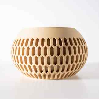 3D-printed honeycomb vase with intricate geometric pattern for stylish interior decoration.