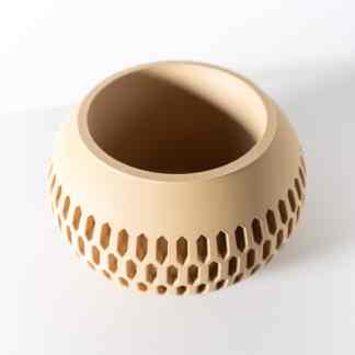 High-quality 3D-printed beige object with honeycomb pattern, showcasing innovative design and manufacturing.