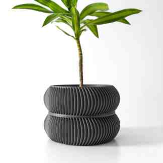 Stylish 3D-printed black ribbed plant pot for modern home decor and indoor plants.