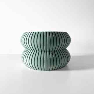 Elegant 3D-printed vase with modern design, suitable for home decor and art displays.