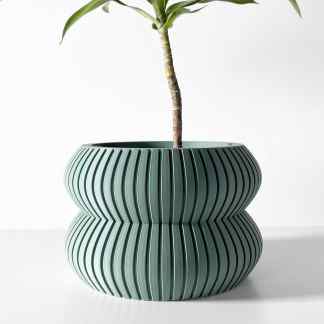 Stylish green ribbed plant pot with a contemporary design, perfect for indoor plants.