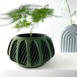 3D-printed geometric vase with green plant, modern home decor, artistic design.
