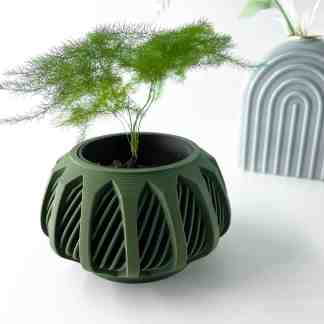 A 3D printed green plant pot with detailed geometric patterns, emphasizing modern 3D printing innovation for home decor.