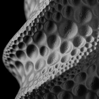 Close-up of a black and white 3D printed honeycomb pattern with intricate texture.