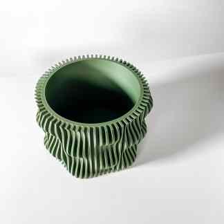 3D printed green geometric vase with textured design, highlighting advanced 3D printing technology.