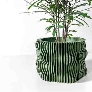 Stylish 3D-printed green plant pot with unique wave pattern for modern interior decoration.