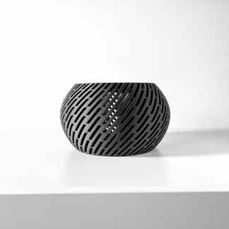 Black geometric patterned 3D-printed vase on a white surface for modern interior decor.