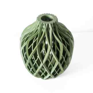 Detailed green 3D-printed vase with intricate lattice design, showcasing advanced additive manufacturing techniques.
