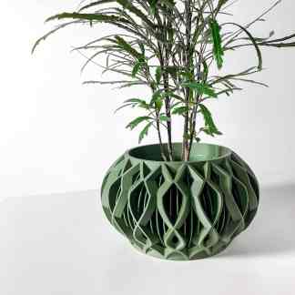 3D-printed green planter with detailed geometric pattern, perfect for modern home decor.