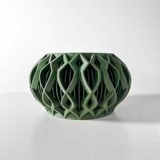 Unique green 3D printed vase showcasing complex geometric patterns and modern craftsmanship.