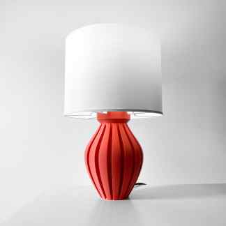 High-quality 3D-printed red table lamp with a white lampshade, stylish home lighting fixture, and modern decor piece.