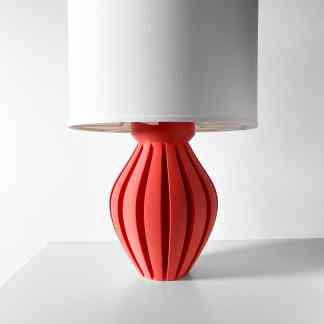 3D printed table lamp with a stylish white shade and a striking red geometric base, ideal for modern interior design.