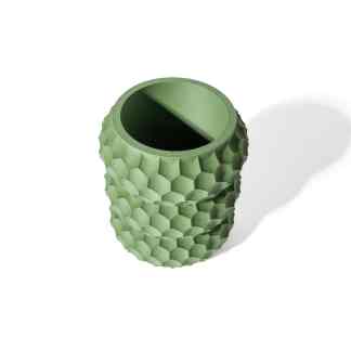 A 3D printed cylindrical object with a honeycomb pattern, showcasing advanced additive manufacturing techniques.