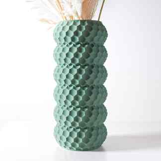 A stylish, green vase featuring a geometric hexagon design, perfect for contemporary interior decoration.