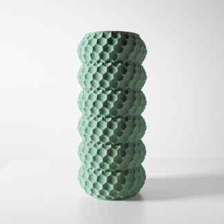 Detailed image of a modern, geometric hexagon-shaped 3D-printed vase in mint green.