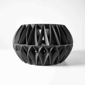 A modern black 3D-printed decorative sculpture with intricate geometric design on a white background.