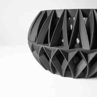 High-quality 3D printed black geometric sculpture展示 innovative design and precision craftsmanship.