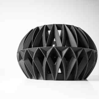 A modern 3D printed black geometric art sculpture showcasing intricate design and craftsmanship.