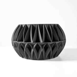 Intricate black 3D printed geometric vase with modern design, ideal for home décor and art collections.