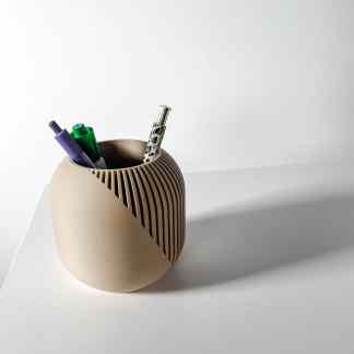 Stylish beige pen holder with vertical slats, holding colorful pens, perfect for office organization.