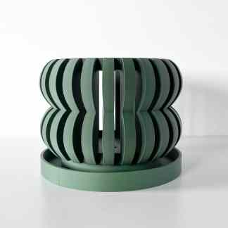 Modern abstract 3D sculpture in green with layered design.