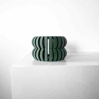 Stylish 3D printed green stool with unique design, perfect for modern interior accents.