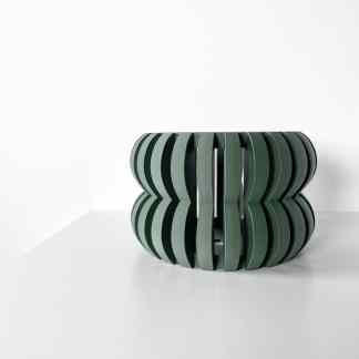 Stylish green 3D printed stool with curved wooden design for modern interiors.