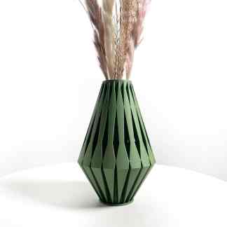 Modern green geometric 3D-printed vase with pampas grass.
