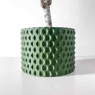 Detailed view of a green 3D printed plant pot featuring a modern geometric pattern for stylish interior accents.