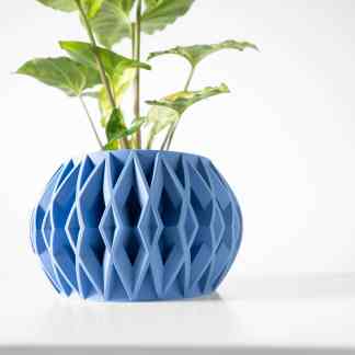 A stylish blue 3D-printed planter with a detailed geometric pattern designed for contemporary interiors.
