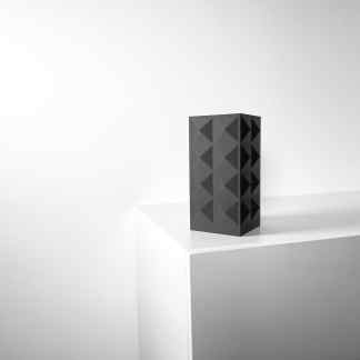High-quality 3D printed modern black sculpture on white display, showcasing innovative design.