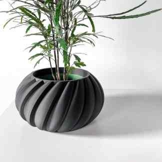 Stylish black ribbed vase with modern design, perfect for interior decor or floral arrangements.